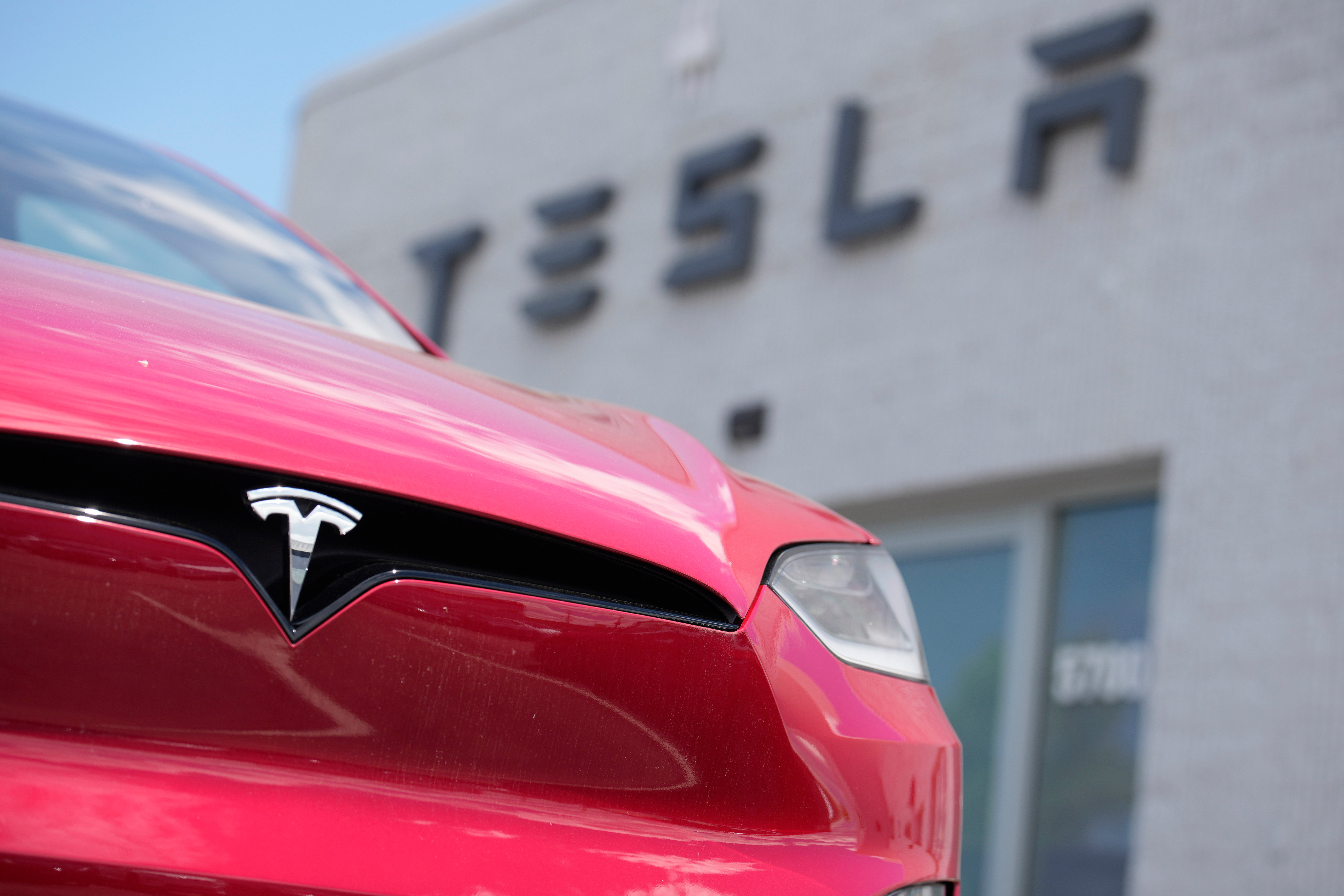 An unsold 2023 Model X sports-utility vehicle sits outside a Tesla dealership June 18, 2023, in Littleton, Colo.