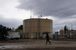 Ileana Miranda walks in front of the new San Jerardo cooperative water tank in Salinas, Calif., Dec. 20, 2023.