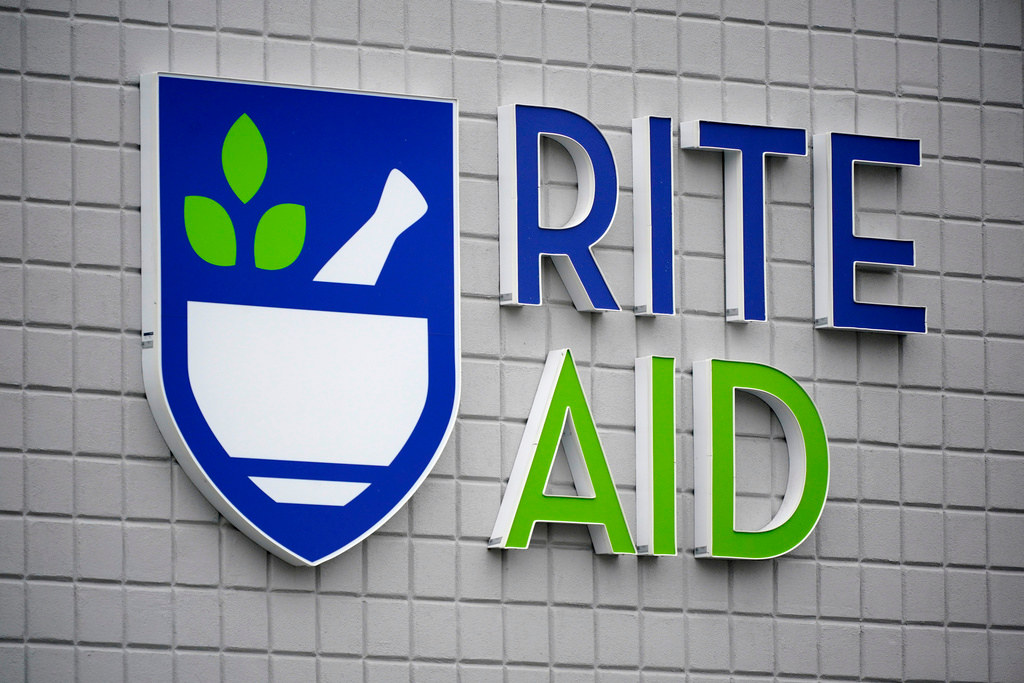 A Rite Aid sign is displayed on the facade of a store in Pittsburgh, Jan. 23, 2023. Rite Aid has been banned from using facial recognition technology for five years over allegations that a surveillance system it used incorrectly identified potential shoplifters, especially Black, Latino, Asian or female shoppers. The deal announced late Tuesday, Dec. 19, settles Federal Trade Commission charges that the struggling drugstore chain didn’t do enough to prevent harm to its customers and implement “reasonable procedures,” the government agency said.