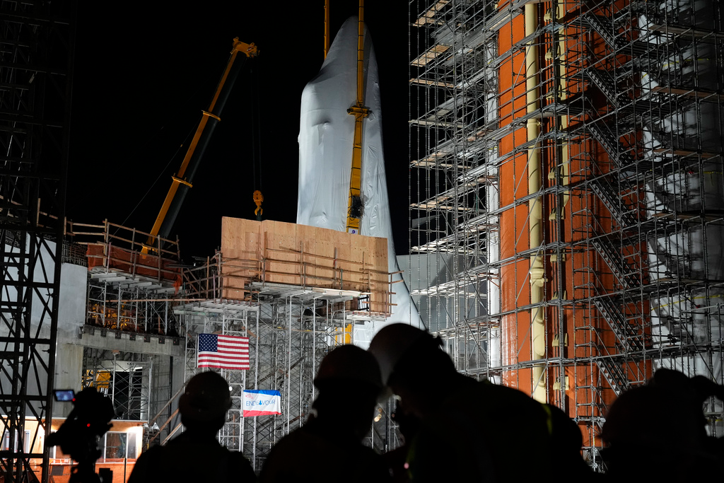 Space Shuttle Endeavour is lifted into the site of the future Samuel Oschin Air and Space Center on Monday, Jan. 29, 2024, in Los Angeles.