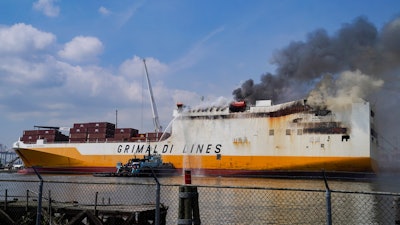 Emergency personnel battle against a fire aboard the Italian-flagged Grande Costa d'Avorio cargo ship at the Port of Newark, Friday, July 7, 2023, in Newark, N.J.