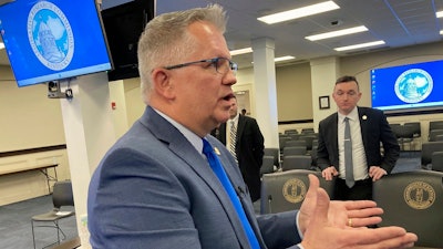 Kentucky state Sen. Danny Carroll speaks with reporters, Feb. 20, 2024, in Frankfort, Ky.