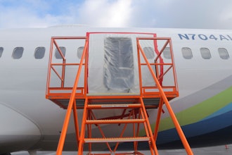This photo released by the National Transportation Safety Board shows a gaping hole where the paneled-over door had been at the fuselage plug area of Alaska Airlines Flight 1282, Jan. 7, 2024, in Portland, Ore.