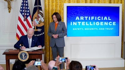 President Joe Biden signs an executive on artificial intelligence in the East Room of the White House, Oct. 30, 2023, in Washington.