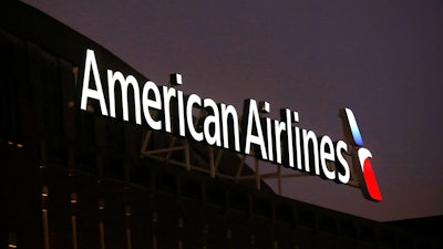 The American Airlines logo is seen atop the American Airlines Center, Dec. 19, 2017, in Dallas.