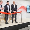 From left, ABB's Marc Segura, John Bubnikovich and Sami Atiya cut the ribbon on ABB Robotics' renovated facility, Auburn Hills, Mich., March 13, 2024.