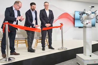 From left, ABB's Marc Segura, John Bubnikovich and Sami Atiya cut the ribbon on ABB Robotics' renovated facility, Auburn Hills, Mich., March 13, 2024.