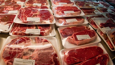 Rows of fresh cut beef are displayed in the coolers of the retail section at the Wight's Meat Packing facility, June 16, 2022, in Fombell, Pa. The U.S. Department of Agriculture on Monday, March 11, 2024, announced new requirements for meat and egg producers who use the voluntary “Product of USA” or “Made in the USA” labels on their products. ()