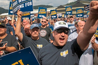 Tom Duffy of Clairton raises his fist as hundreds of United Steelworkers rally and march on Thursday, Aug. 30, 2018, in Clairton, Pa.