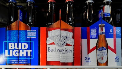 Six-packs of Bud Light, Budweiser and Michelob Ultra are displayed at a liquor store, Wednesday, Feb. 28, 2024, in Fairfield, Calif. Budweiser brewer Anheuser-Busch has reached a contract agreement with the Teamsters union that avoids a strike at its U.S. plants. The union had threatened a strike at the brewer’s 12 U.S. plants if an agreement on a new five-year contract wasn’t reached by 11:59 p.m. EST Thursday.