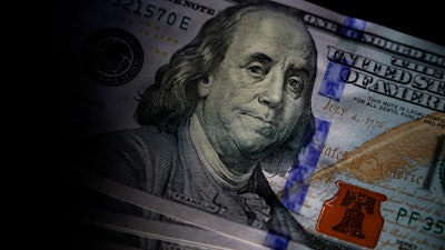 The likeness of Benjamin Franklin is seen on U.S. $100 bills, Thursday, July 14, 2022, in Marple Township, Pa.