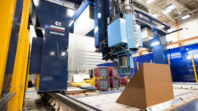 A cross section of an exterior wall of a house is being printed on a 3D printer at the University of Maine's Advanced Structures & Composite Center on Oct. 12, 2023, in Orono, Maine.