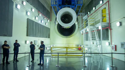 Engineers and workers stand inside Safran Aircraft Engines repair plant outside of Casablanca, Morocco, Thursday, April 18, 2024.