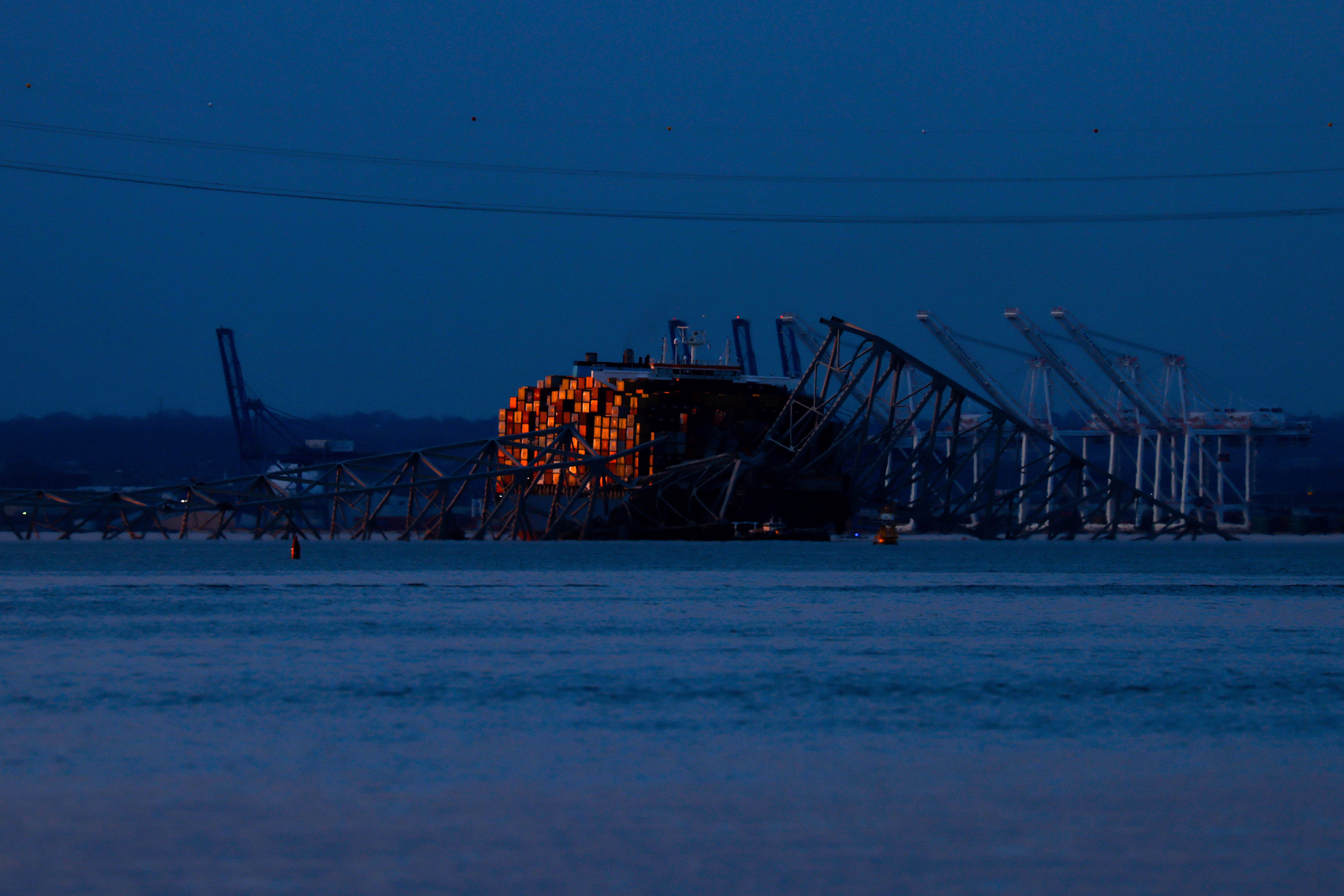 Wreckage of the Francis Scott Key Bridge rests on the container ship Dali, Baltimore, March 31, 2024.