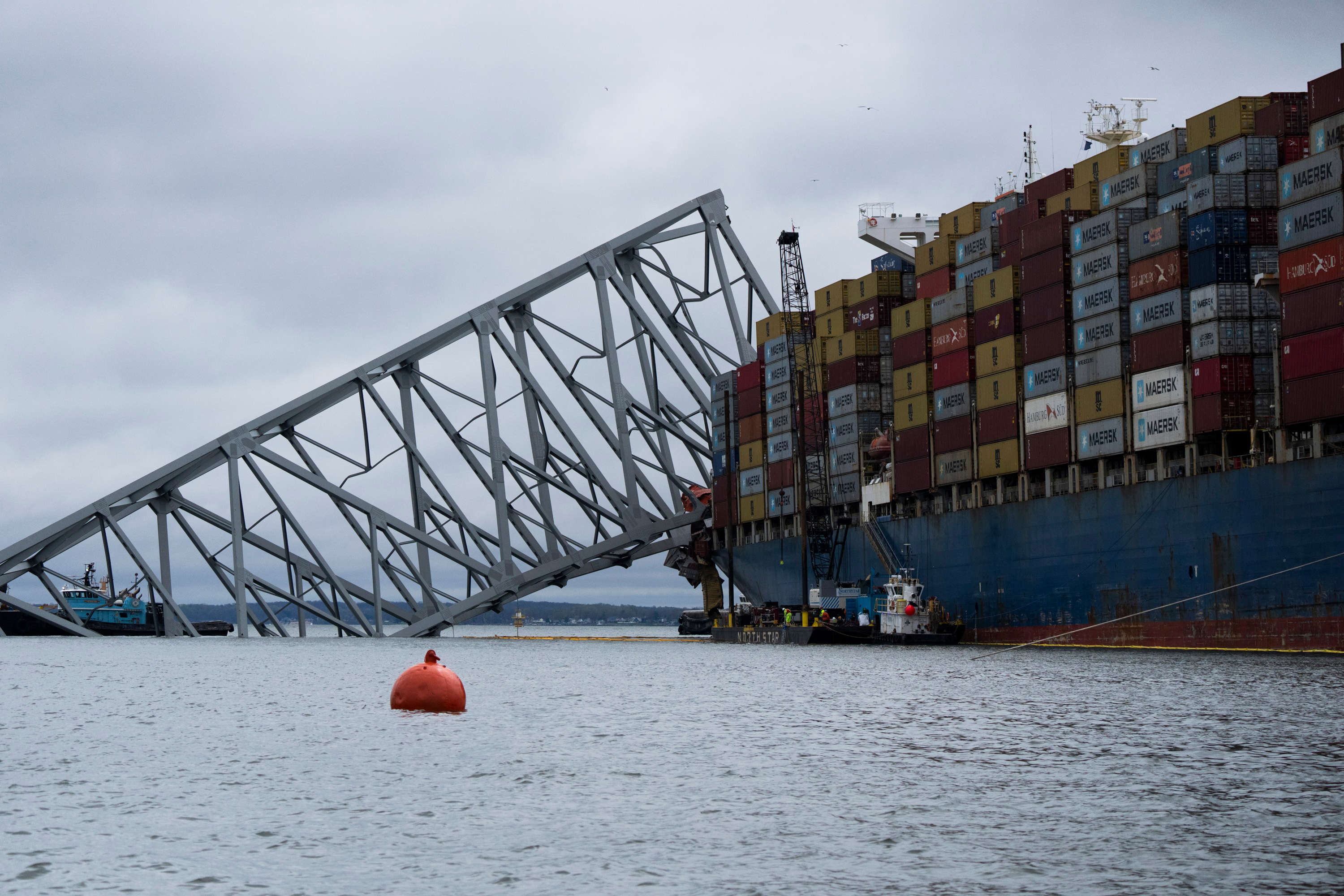 The Dali, a massive container ship from Singapore, still sits amid the wreckage and collapse of the Francis Scott Key Bridge in the Baltimore port, Monday, April 1, 2024.