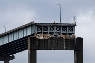 A section of the damaged and collapsed Francis Scott Key Bridge is seen, in the Baltimore port, Monday, April 1, 2024.