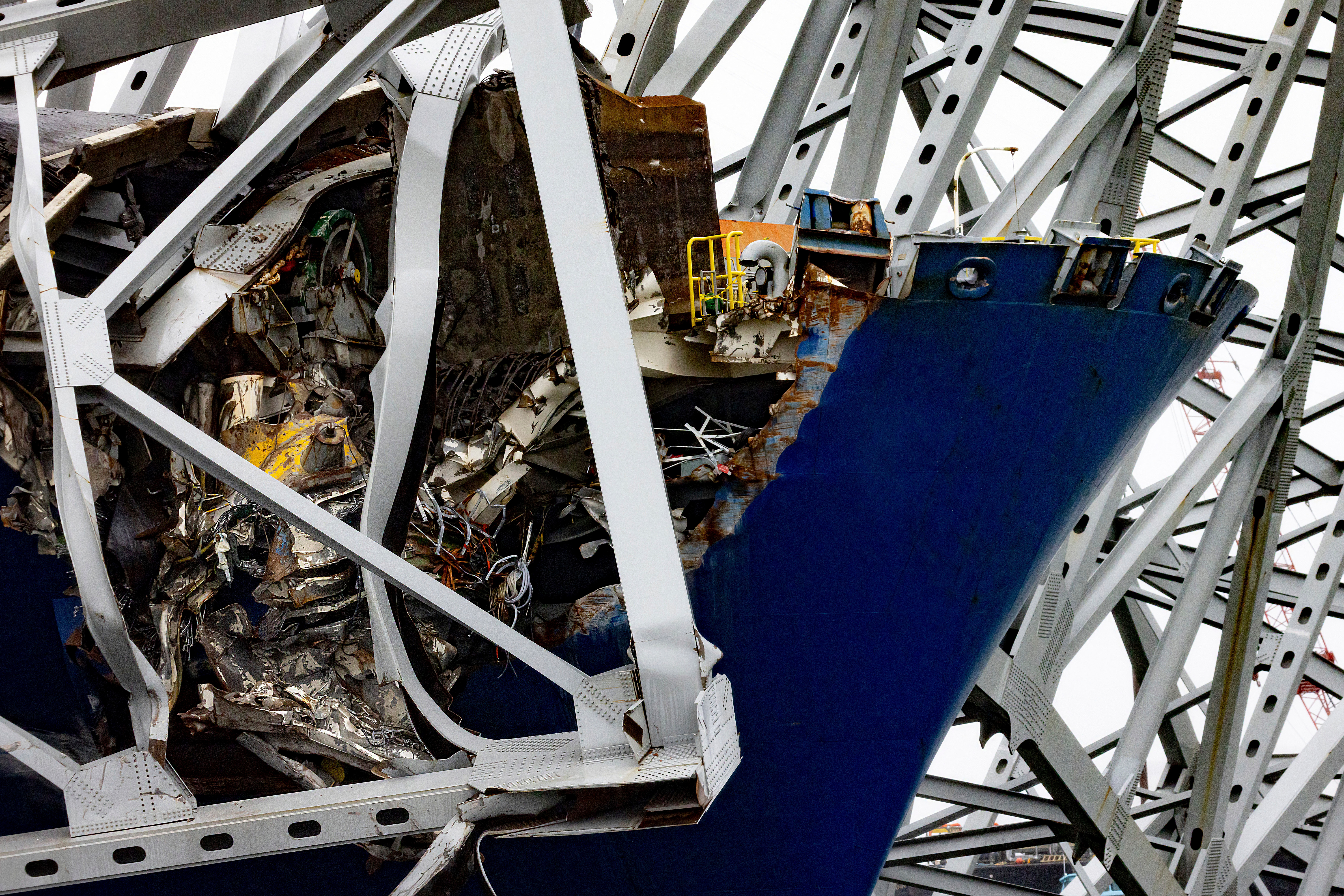 Wreckage of the Francis Scott Key Bridge rests on the container ship Dali, Wednesday, April 3, 2024, in Baltimore.