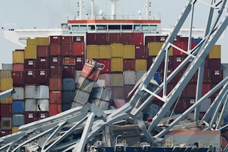 The container ship Dali is stuck under part of the Francis Scott Key Bridge after the ship hit the bridge, March 26, 2024, in Baltimore, Md.