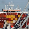 People are seen aboard the container ship Dali, Monday, April 15, 2024, in Baltimore.