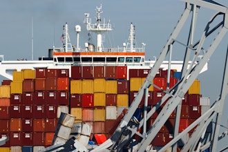 People are seen aboard the container ship Dali, Monday, April 15, 2024, in Baltimore.