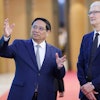 Vietnamese Prime Minister Pham Minh Chinh, left, speaks to Apple CEO Tim Cook, right, before their meeting in Hanoi, Vietnam on Tuesday, April 16, 2024.
