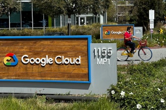 A person rides past the Google sign outside the Google offices in Sunnyvale, Calif., on Thursday, April 18, 2024.