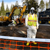 Environmental cleanup specialists work at one of the last remaining residential asbestos cleanup sites in Libby, Montana, in mid-September.