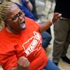 Volkswagen automobile plant employee Vicky Holloway celebrates as she watches the results of a UAW union vote, late Friday, April 19, 2024, in Chattanooga, Tenn.