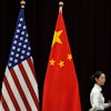 A hostess walks by the national flags of the United States and China ahead of the bilateral meeting between U.S. Treasury Secretary Janet Yellen and Chinese Vice Premier He Lifeng, at the Guangdong Zhudao Guest House in southern China's Guangdong province, April 6, 2024.