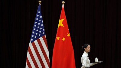U.S. and China flags at a meeting between U.S. Treasury Secretary Janet Yellen and Chinese Vice Premier He Lifeng, Guangdong Zhudao Guest House, Guangzhou, China, April 6, 2024.