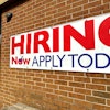 A hiring sign is displayed in Riverwoods, Ill., Tuesday, April 16, 2024.