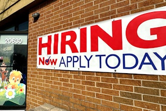 A hiring sign is displayed in Riverwoods, Ill., Tuesday, April 16, 2024.
