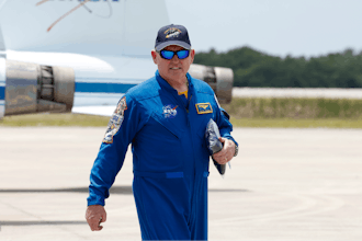 NASA astronaut Butch Wilmore, walks past NASA jets after he arrived at the Kennedy Space Center, Thursday, April 25, 2024, in Cape Canaveral, Fla.