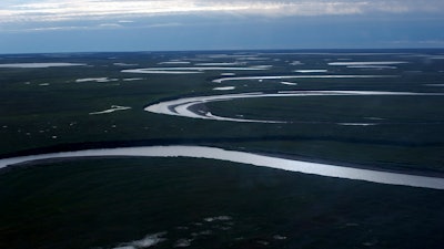 This July 8, 2004, photo provided by the United States Geological Survey shows Fish Creek through the National Petroleum Reserve-Alaska, managed by the Bureau of Land Management on Alaska's North Slope.
