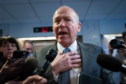 Boeing CEO David Calhoun speaks briefly with reporters after a meeting in the office of Sen. Mark Warner, D-Va., at the Capitol in Washington, Jan. 24, 2024.