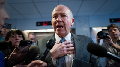 Boeing CEO David Calhoun speaks briefly with reporters after a meeting in the office of Sen. Mark Warner, D-Va., at the Capitol in Washington, Jan. 24, 2024.