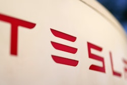 The logo for a Tesla Supercharger station is seen in Buford, Ga, April 22, 2021.