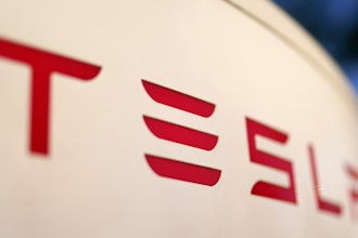 The logo for a Tesla Supercharger station is seen in Buford, Ga, April 22, 2021.