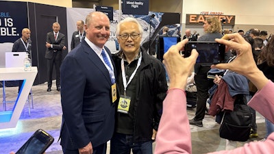 Berkshire Hathaway Vice Chairman Greg Abel poses for pictures with shareholders, May 3, 2024, Omaha, Neb.