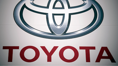 The Toyota Motor Corp. logo is seen, May 11, 2022, at a dealer in Tokyo.