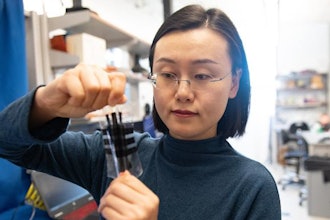 Aerospace engineering professor Nanshu Lu with the stretchable e-skin she created.