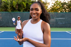 This undated photo provided by Mattel Inc., shows Venus Williams holding a Venus Williams Barbie Doll.