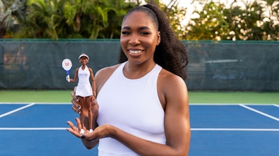 This undated photo provided by Mattel Inc., shows Venus Williams holding a Venus Williams Barbie Doll.