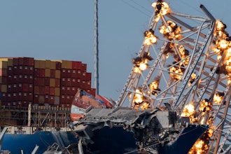 Explosive charges are detonated to bring down sections of the collapsed Francis Scott Key Bridge resting on the container ship Dali on Monday, May 13, 2024, in Baltimore.