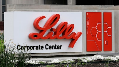 A sign for Eli Lilly & Co. sits outside their corporate headquarters in Indianapolis on April 26, 2017.