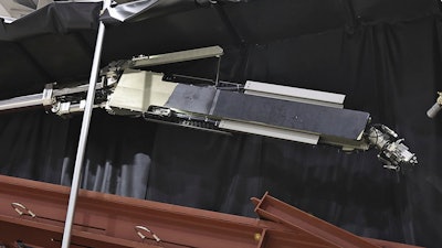 Tokyo Electric Power Company Holdings, also known as TEPCO, the operator of Japan's wrecked Fukushima Daiichi nuclear power plant, reveals a robot to be used to retrieve debris at the power plant in Kobe, western Japan, Tuesday, May 28, 2024.