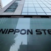 Nippon Steel Corporation's logo is displayed on a sign outside its headquarters in Tokyo on Nov. 26, 2021.