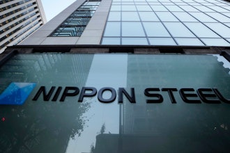 Nippon Steel Corporation's logo is displayed on a sign outside its headquarters in Tokyo on Nov. 26, 2021.