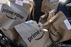 Amazon Prime Now bags loaded for delivery outside a Whole Foods store, Cincinnati, Feb. 8, 2018.