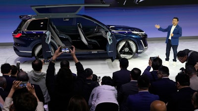 Jerry Gan, CEO of Geely Auto Group unveils the Galaxy Starship a new technology flagship AI-driven SUV prototype during Auto China 2024 in Beijing, Thursday, April 25, 2024.